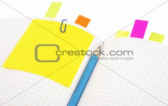 Notebook with pencil and bookmarks