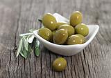 Green olives in the bowl 