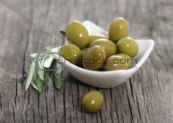 Green olives in the bowl 