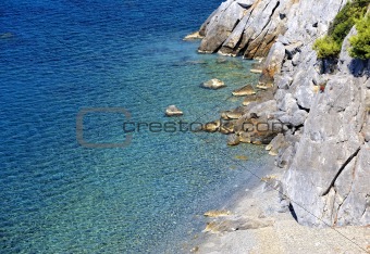 Clear sea water with stones