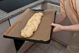 Push braided yeast bun into a oven
