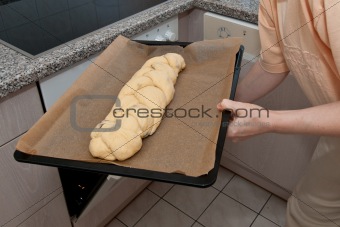 Push braided yeast bun into a oven