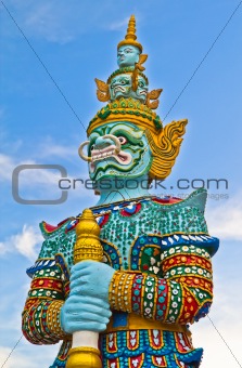 Guardian statue at the temple in Thailand 
