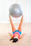 Fitness girl doing exercises with fitness ball
