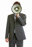 Modern businessman holding megaphone in front of face
