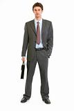 Full length portrait of modern businessman with briefcase
