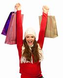 Beautiful young woman happy to finish christmas shopping