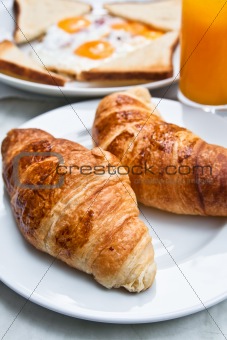 fresh croissant on table