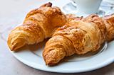 Breakfast with coffee and croissant