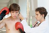 Doctor checking an angry boxer