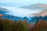 Autumn misty morning mountain valley