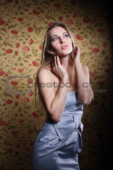 Beauty young blond girl in silver dress