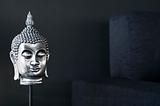 contemporary interior design detail with buddha image and sofa