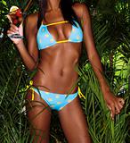 bikini girl crop with cocktail and tropical plants