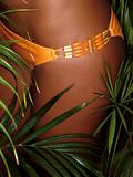 photo of girl thighs in orange bikini
