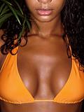 photo of girl breasts in orange bikini