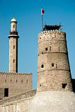 tower and minaret in old fort area of dubai