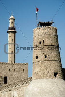 tower and minaret in old fort area of dubai
