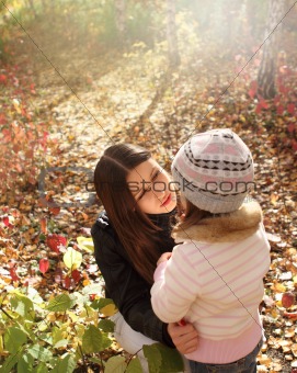 Two sisters in autumn forest