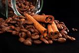 grains of coffee and stick cinnamon