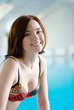 Smiling girl at the swimming pool