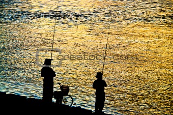 Fisherman silhouette  on shoreline