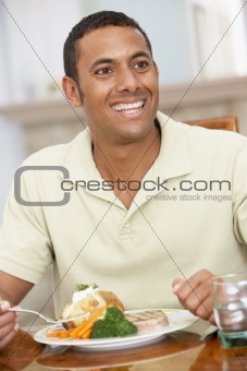 Man Enjoying A Meal At Home