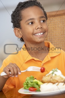 Young Boy Enjoying A Meal At Home