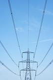 Electricity Pylons Against A Blue Sky
