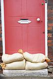 Sandbags Stacked In A Doorway In Preparation For Flooding