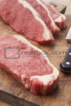 Sliced Steak On Wooden Cutting Board
