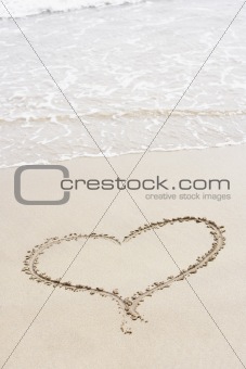 Heart Shape Drawn In The Sand On The Beach