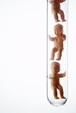 Baby Figurines In Test Tubes