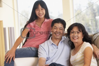 Family Sitting Together At Home