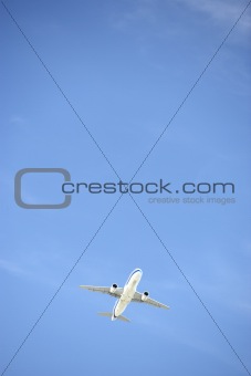 Commercial Airplane Flying Against A Blue Sky