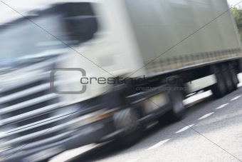 Truck Driving Along The Road