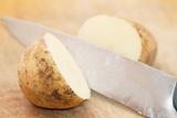One Kestrel potato cut in half.