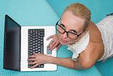 woman in glasses with a laptop