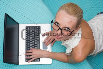 woman in glasses with a laptop