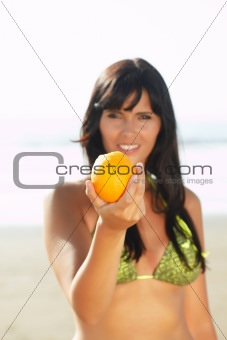 women offering you an orange