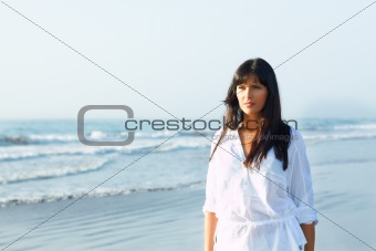girl walking along the seashore