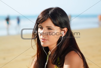 woman on the beach  listening to music