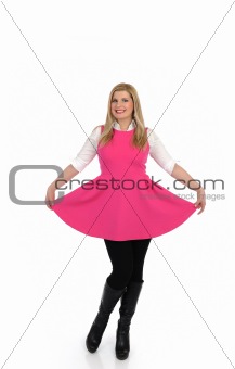 pretty woman in pink dress standing. studio shot. isolated 