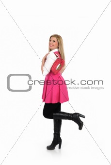pretty shopping woman in pink dress standing. studio shot.