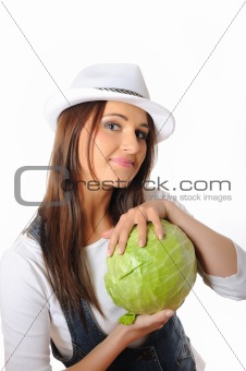 Young pretty woman with green beautiful cabbage . isolated