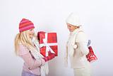 Two pretty winter girls friends making presents