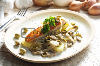 baked salmon on champignons, onion and olives