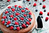 chocolate cake with raspberries and blueberries