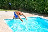 Man jumping to swimming pool