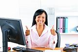 Businesswoman giving thumbs up